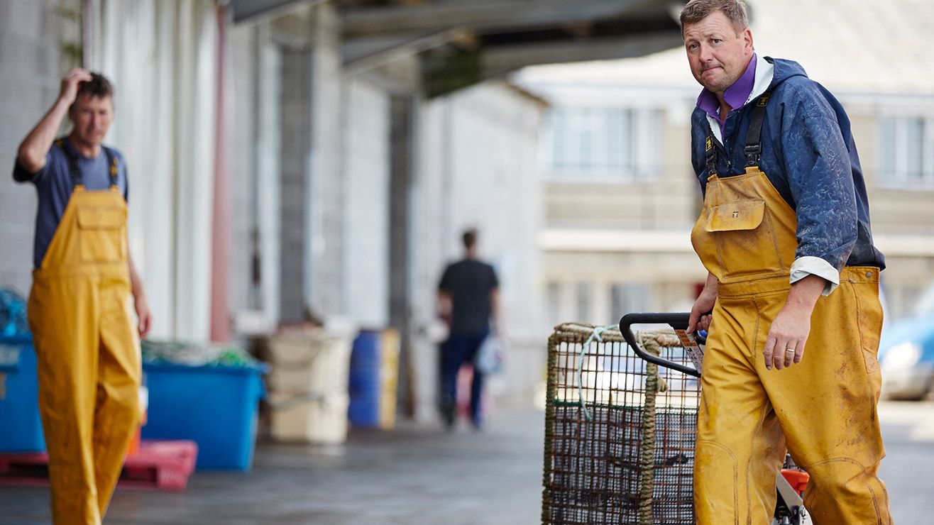 Workers at a fish market