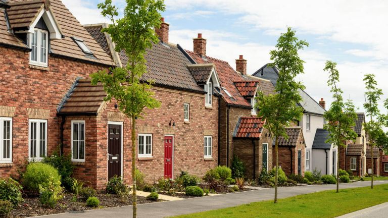  A row of houses on a street.