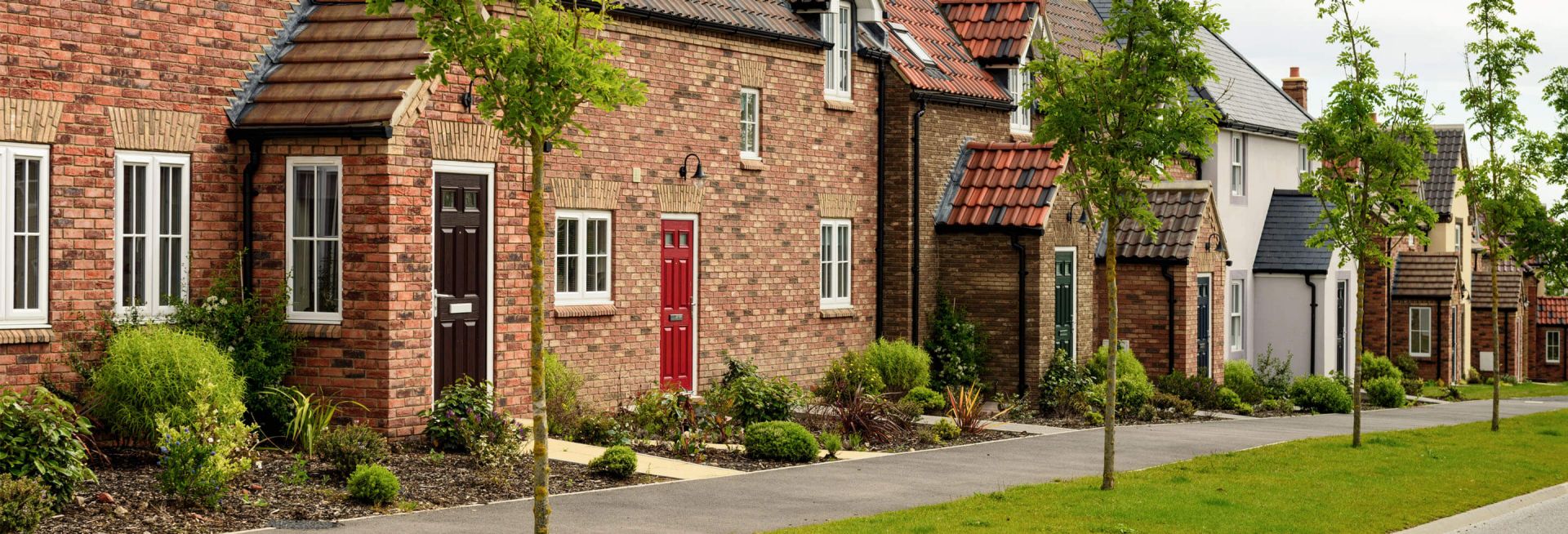  A row of houses on a street.