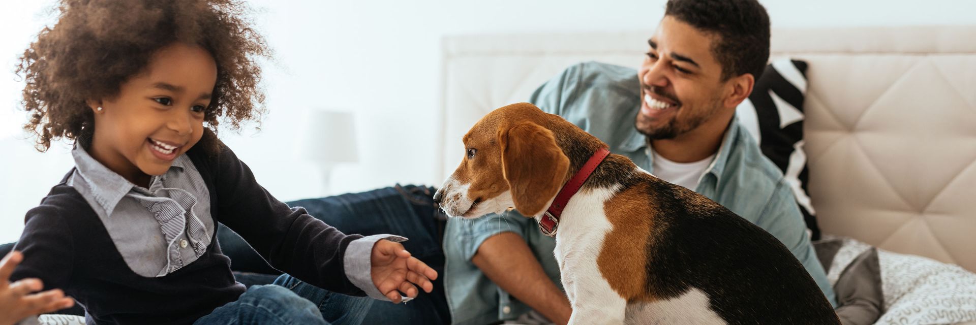 Father and daughter with dog.