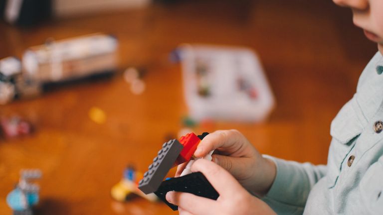  A child playing with Lego bricks